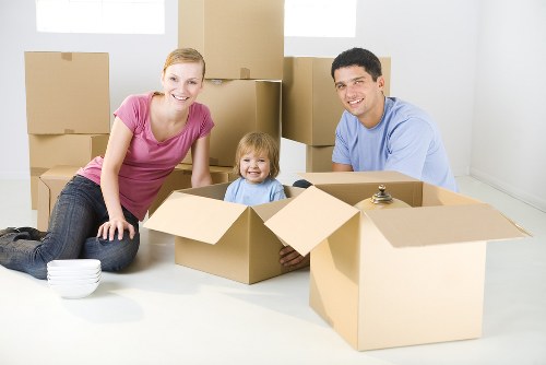 Professional home moving team handling household items in North London