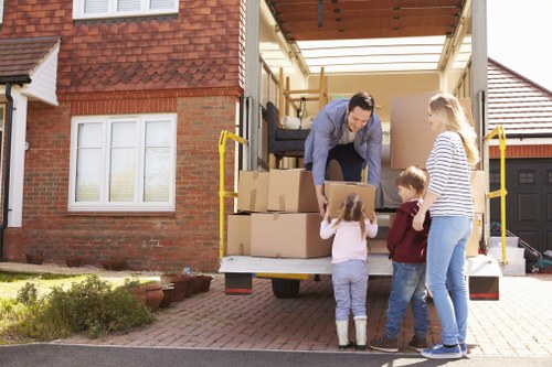 Packed moving boxes and furniture ready for transport in North London