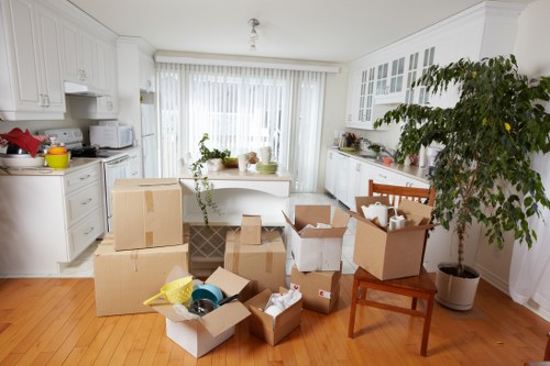 Local moving team unloading household items at a Finsbury Park property