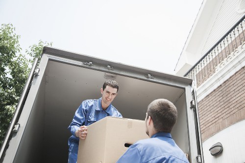 Local moving team handling boxes and furniture for a home relocation